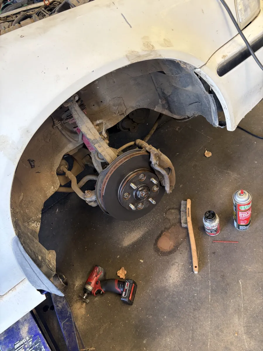 Front brake job in progress with the wheel off