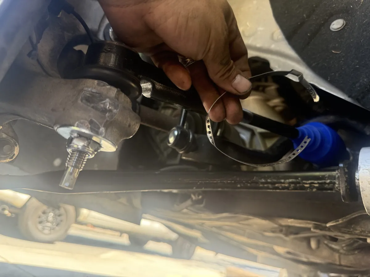 Replacing a coolant hose clamp under the hood